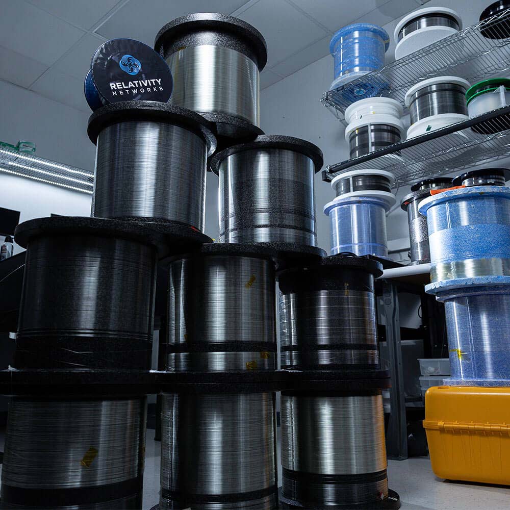 Fiber-optic cables stacked in a pyramid shape