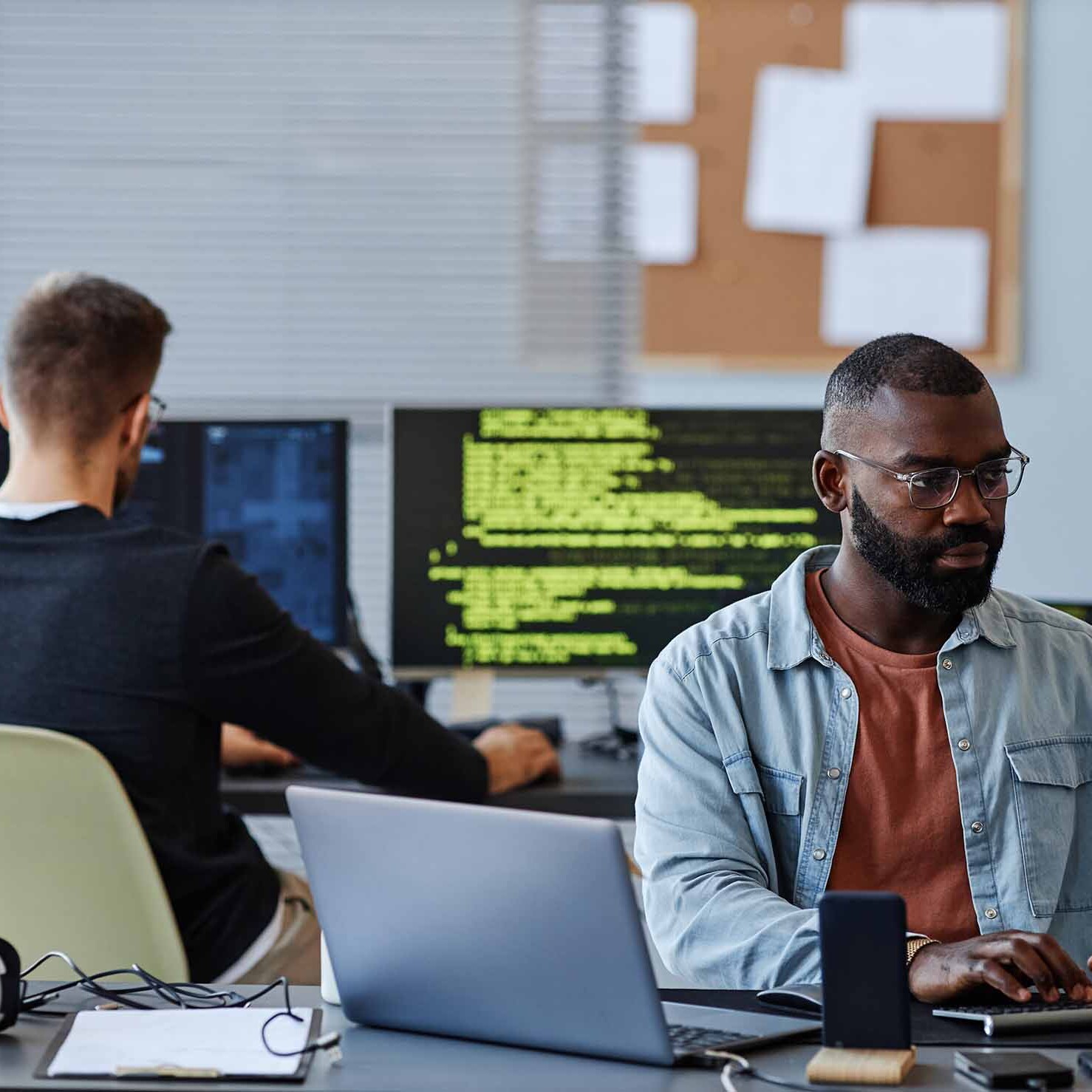 Two men working on a data network